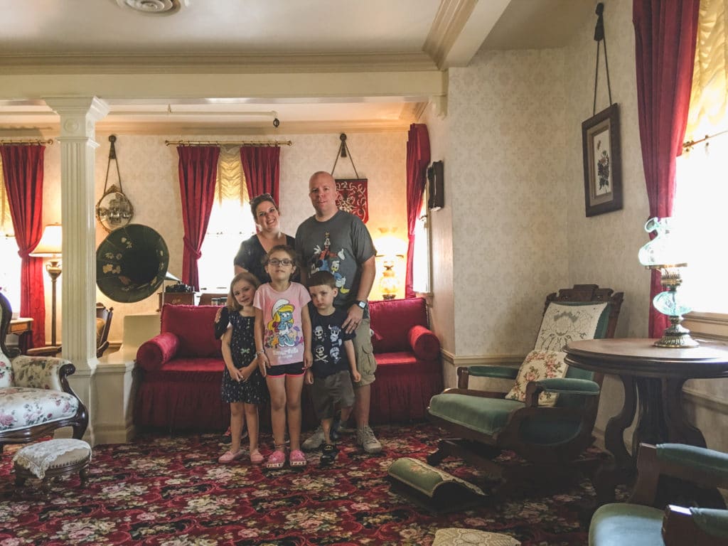 Ear To There Travel's founder and CEO, Phil Gramlich, poses with his wife and kids during a VIP tour of Walt Disney's private apartments in Disneyland