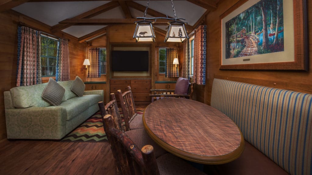 Comfy couches, wooden furniture and quaint woodsy decor bedeck the Fort Wilderness cabins of Walt Disney World