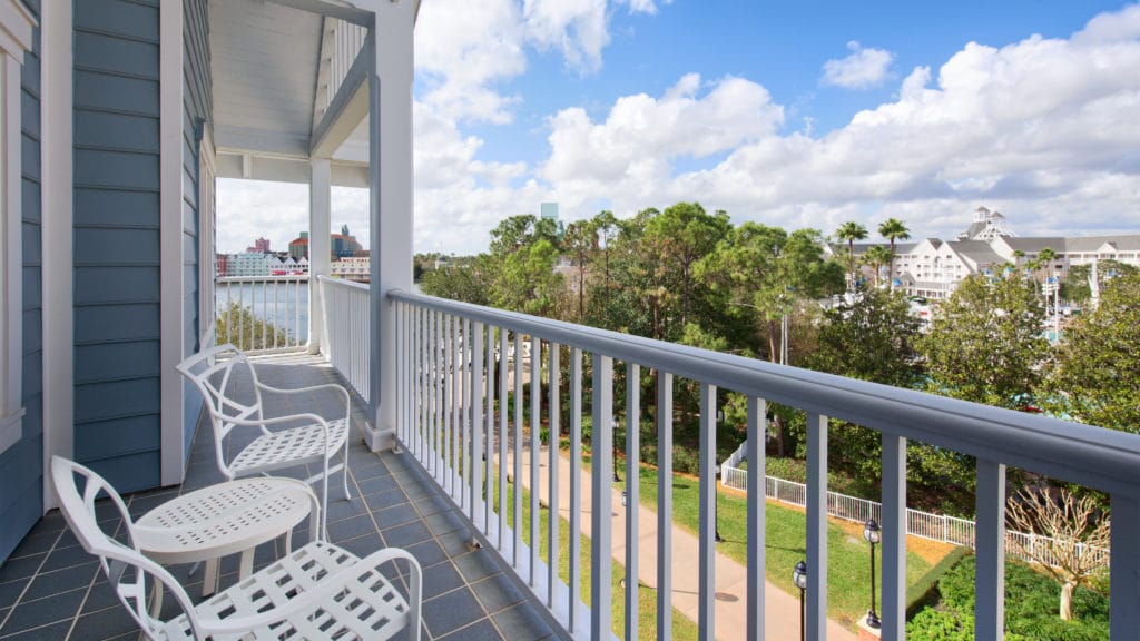 Enjoy the sunny, rich view of Florida from the old-fashioned, New England-style chairs on the beautiful Beach Club Resort balconies in Walt Disney World.