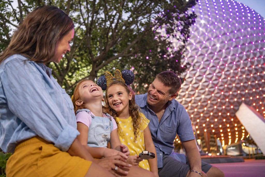 A family with toddlers having fun at Epcot in Walt Disney World.