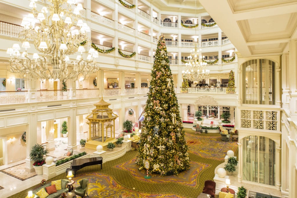 A glistening, golden Christmas tree dominates the lobby and climbs to several stories high in the elegant, classy, high-end, grown-up, Victorian-styled Grand Floridian Hotel & Spa in Walt Disney World, Florida.