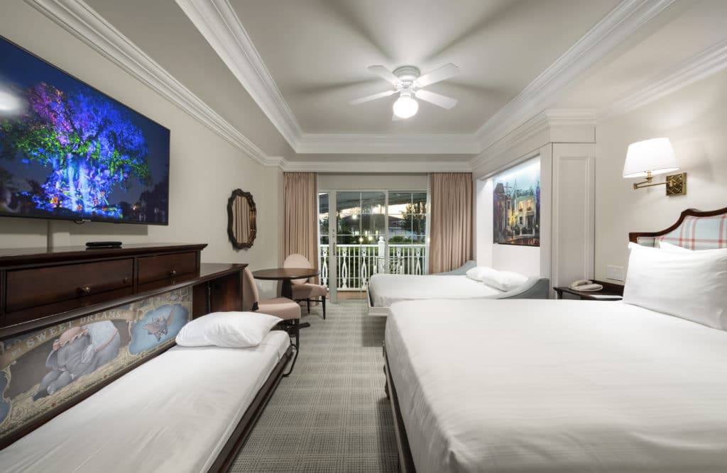 For adults traveling to Disney World, seek out the light, bright, sleek elegance of rooms like this decked out with tis and balconies and tasteful Victorian decor - only to be found at Disney's Grand Floridian Hotel & Spa.