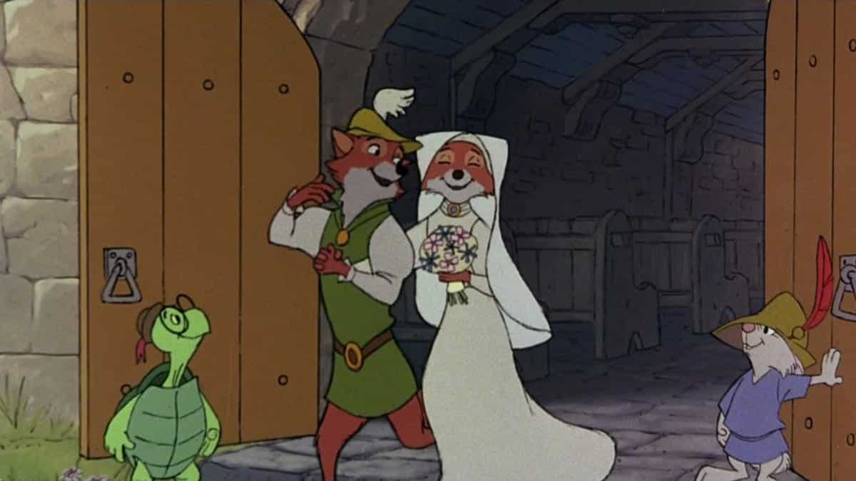 Disney's Robin Hood and Maid Marian happily emerge from the church where they married to greet their friends - and perhaps rush off to their honeymoon at Disney World too!