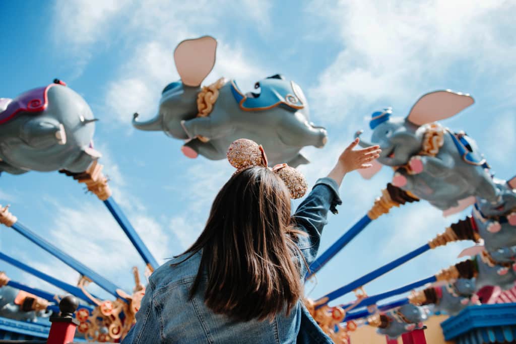 Take a plane, train, bus, car, or flying elephant as pictured here - but just make sure you factor in travel to and from your port when considering Disney Cruise cost