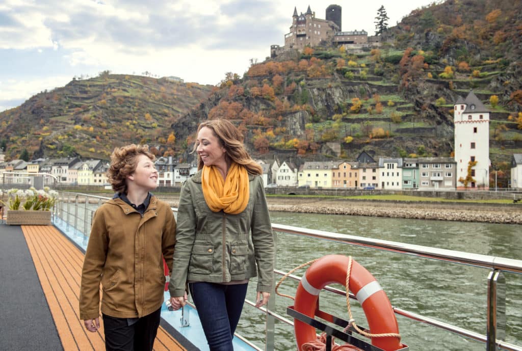 Great Disney Deals allow this mother and son to cruise along the beautiful autumn-decorated Rhine river with Adventures by Disney