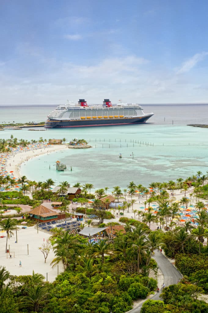 One of the splendid Disney ships in the Disney Cruise Line fleet, the Disney Fantasy, resides peacefully in the private Disney Island of Castaway Cay