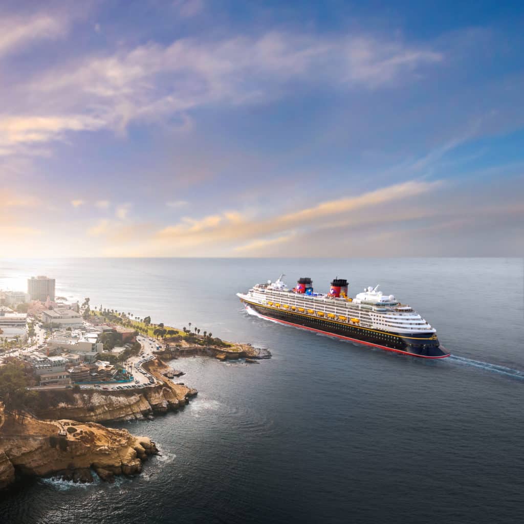 One of the wonderful Disney ships in the Disney Cruise Line fleet, the Disney Wonder, in fact, sails joyfully pas La La Jolla, CA as the sun sets.